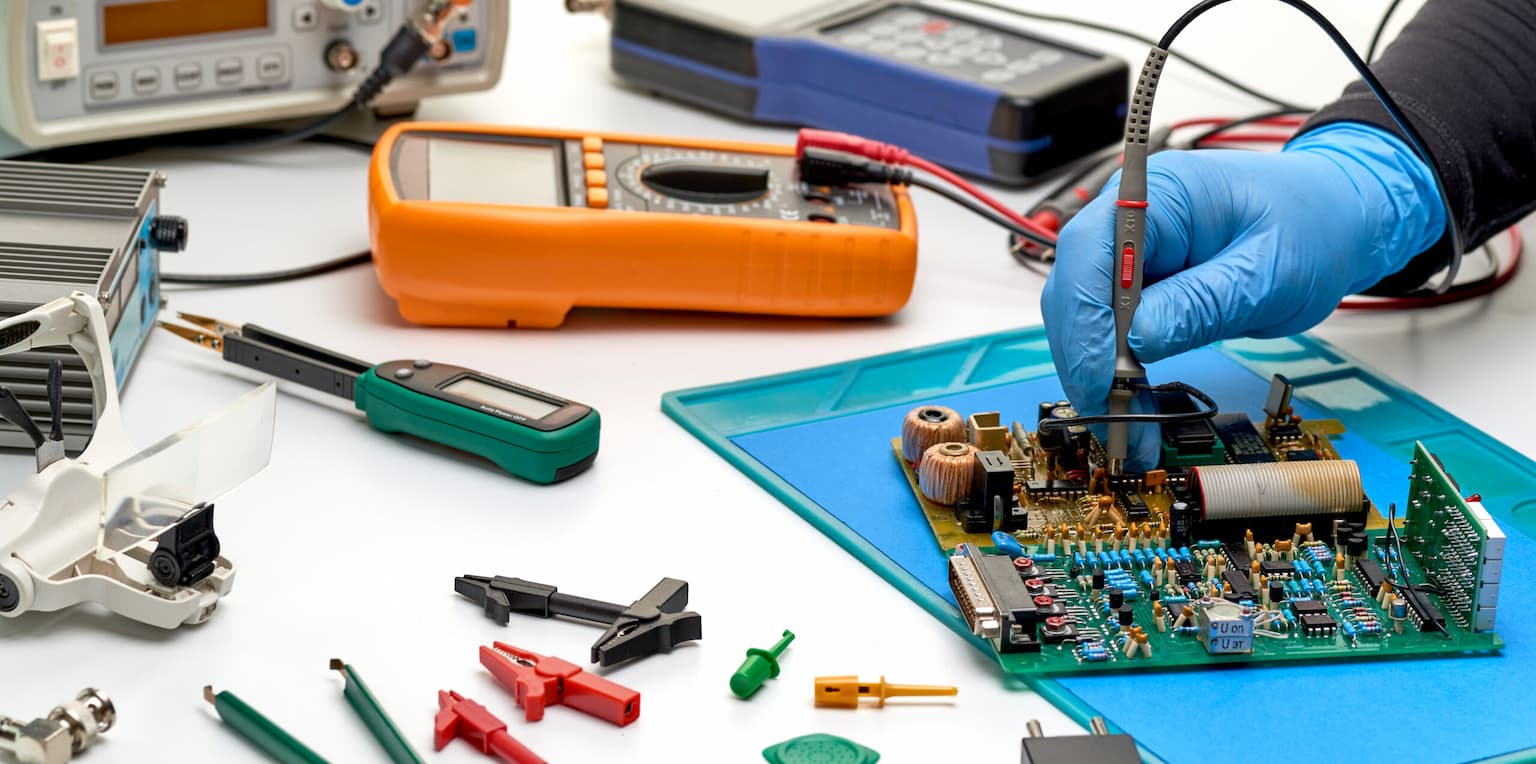 Technician troubleshooting industrial equipment